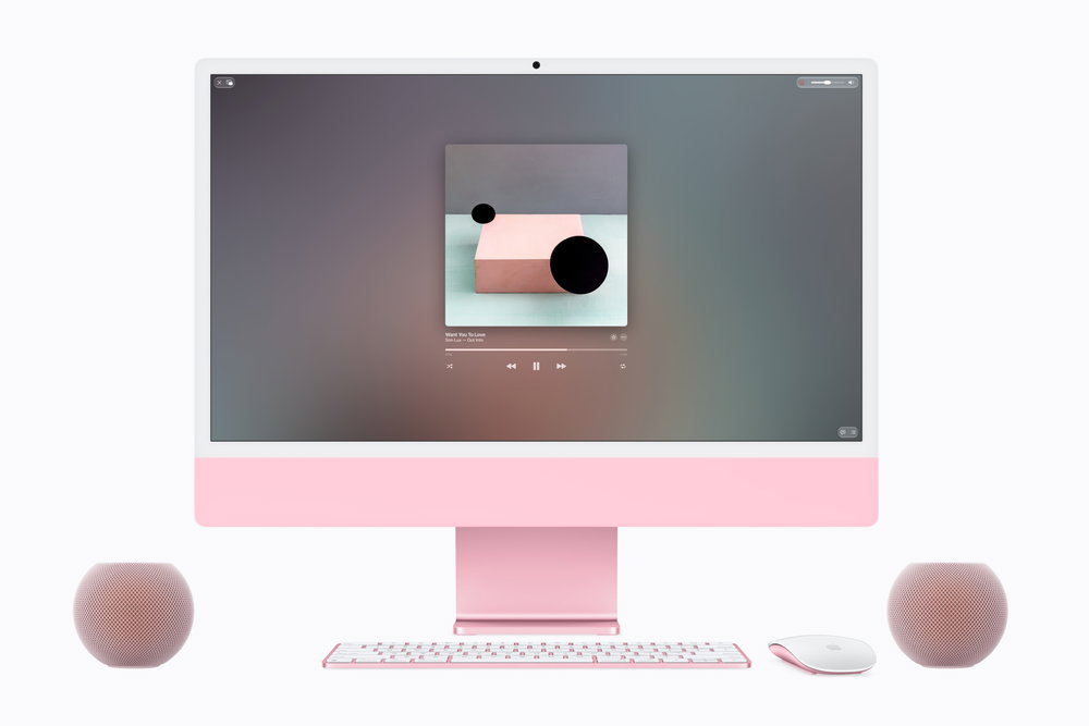 Een iMac met twee HomePod mini 2-speakers als voorbeeld van de samenwerking tussen Mac en HomePod.